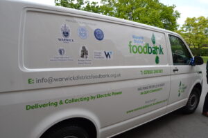 The new foodbank van with logos of the supporting schools
